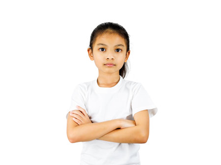 Asia littel girl standing with folded arms isolated on white background with clipping path.の写真素材