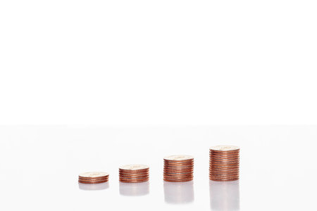 Stack of coins on the table isolated on white background with clipping path. Business. Financeの写真素材