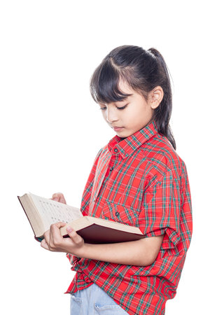 Asian girl reading book isolated on white background with clipping path.の写真素材