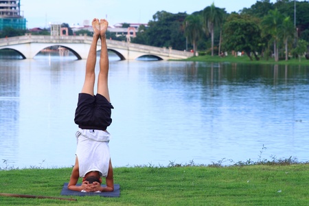 Yoga on the grass in the park