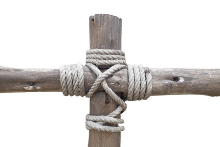  Rope tied to a wooden cross isolated on white backgroundの写真素材