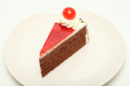 cake chocolate piece place on plate isolated white backgroundの写真素材