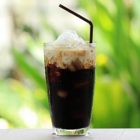Thai Ice Black coffee topping with fresh milk の写真素材