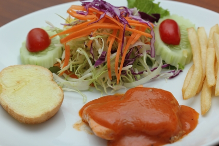 Steak Salmon, French fries and vegetables の写真素材