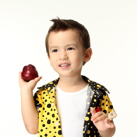 Kid with apple in his hand の写真素材