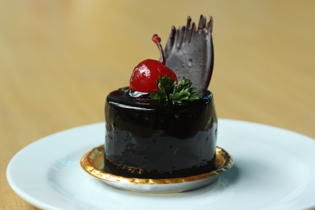 Delicious Molten chocolate pudding  Topping with cherryの写真素材