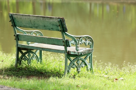 old wooden bench near the lake の写真素材