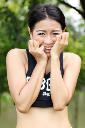 A pretty Asian woman is shocked の写真素材