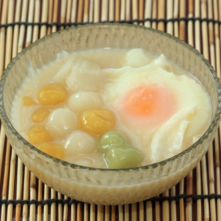 Thai dessert with colorful ball flour, coconut milk and Boil egg の写真素材