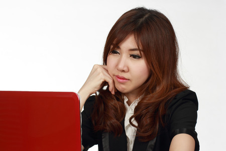 Woman typing on laptop computer on white background  の写真素材