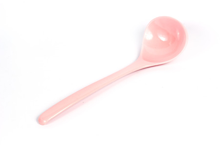 Plastic kitchen ladles isolated on white background の写真素材