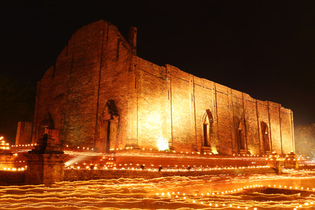Light waving of candle rite walk at Maheyong Temple in Ayutthaya, Thailand の写真素材