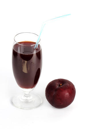 Fresh Prune juice isolated on white backgroundの写真素材