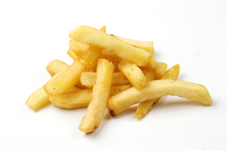 pile of French Fries isolated on white backgroundの写真素材