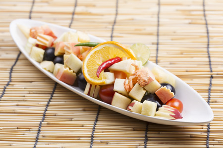 Spicy Fruit Salad Thai style on the plateの写真素材