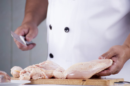 Chef prepared cooking raw chicken for Meal Timeの写真素材