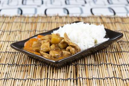 Japanese pork curry with rice ,carrot,onion and potato / Cooking Japanese pork curry conceptの写真素材