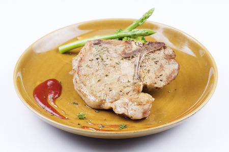 T-bone pork steak on the Plateの写真素材