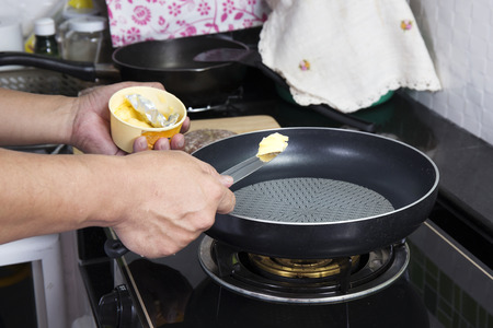 Chef putting butter to the pan  Cooking Hamburger conceptの写真素材