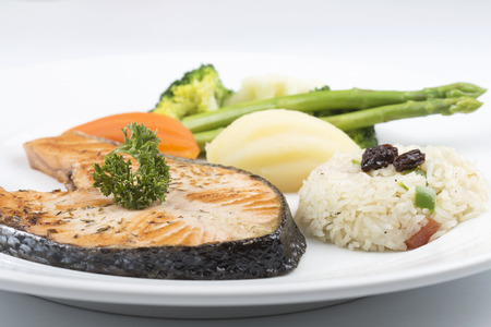 Grilled Salmon steak with Vegetables and Fried Riceの写真素材