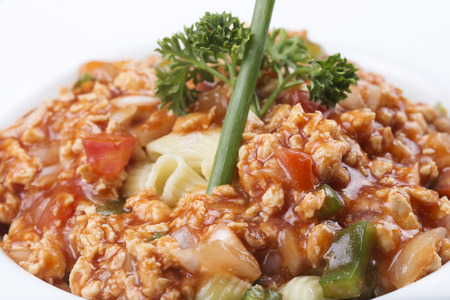Macaroni with tomato chicken sauce on the Plateの写真素材