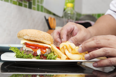 Chef decorated Hamburger and French Fried Cooking Hamburger conceptの写真素材