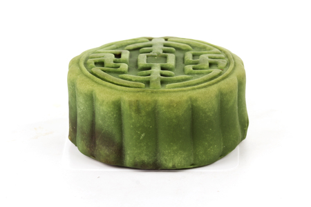 Moon cake with Matcha  Red Bean filling on white background  Autumn festival foodsの写真素材