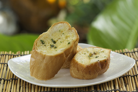 Slice of Garlic bread on the plateの写真素材