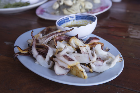 Slice of Grilled squid with Thai seafood sauce