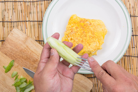 Chef decorated Fired rice bacon with cucumber  / cooking fried rice conceptの写真素材