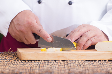 Chef slicing tofu for cooking / Cooking Pad Thai conceptの写真素材