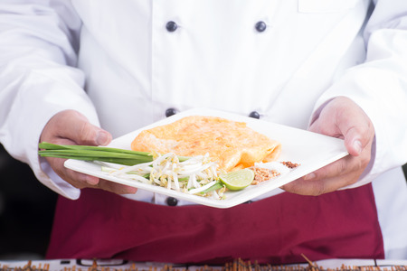Chef presented Pad Thai plate/ cooking Pad Thai conceptの写真素材