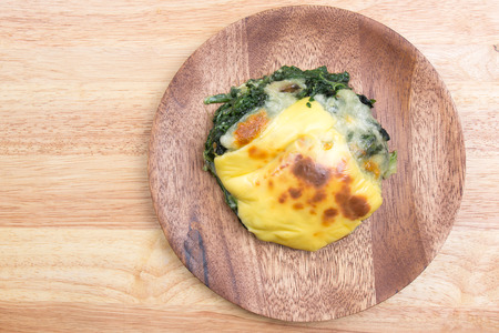 Baked spinach and cheese on plate / cooking Baked spinach conceptの写真素材