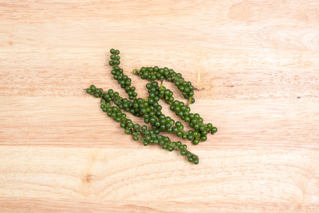 Fresh green pepper on the wooden broadの写真素材