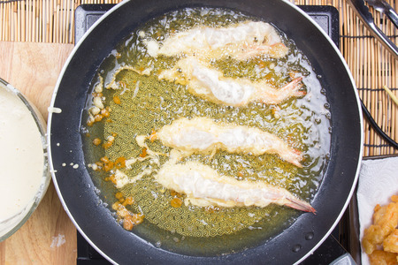 Chef frying shrimp Tempura / Vooking Tempura Udon conceptの写真素材