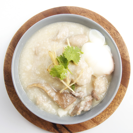 porridge rice in ceramic bowl on white backgroundの写真素材