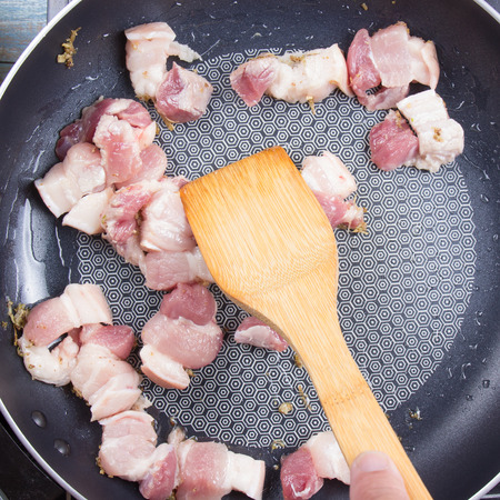 Chef stirfry streaky pork in pan   / Cooking sweet brown Stewed pork gravy (Moo Pa-lo) conceptの写真素材