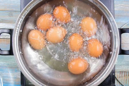 Chef cooking boiled eggs  in pot  / Cooking sweet brown Stewed pork gravy (Moo Pa-lo) conceptの写真素材