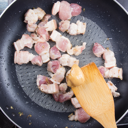 Chef put palm sugar for cooking   / Cooking sweet brown Stewed pork gravy (Moo Pa-lo) conceptの写真素材