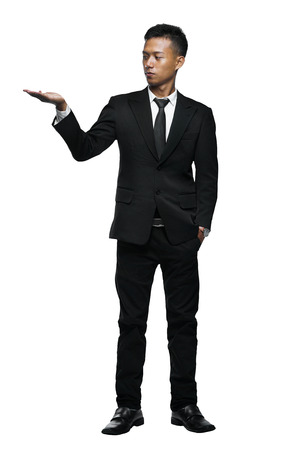 Full Body Young Asian Businessman Presenting Something Isolated White Background      の写真素材