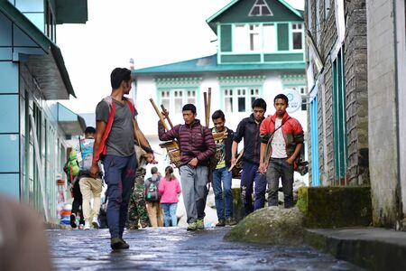 LUKLA, NEPAL - 20 SEPTEMBER 2017: Native People Walking at Lukla Streetのeditorial素材