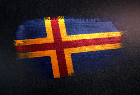 Aland Islands Flag Made of Metallic Brush Paint on Grunge Dark Wallの写真素材