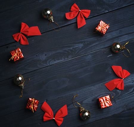 Christmas Ornament Formed Circle on Black Wooden Texture. Top Viewの写真素材