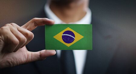 Businessman Holding Card of Brazil Flagの写真素材