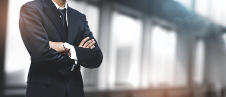 Asian Businessman on Blurred Office Background. Copy Spaceの写真素材