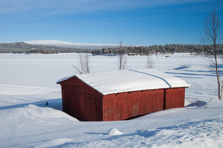 red house in sweden in the winter timeのeditorial素材