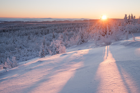 sunrise over a beautiful winter landscape in winterの写真素材