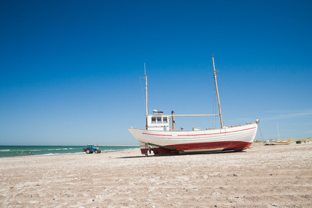boats on a beach in denmarkの写真素材