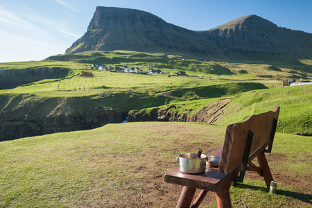 bench on faroe islands during a sunny dayの写真素材