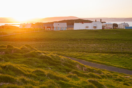 Little houses on Flatey island in Iceland at midnightの写真素材